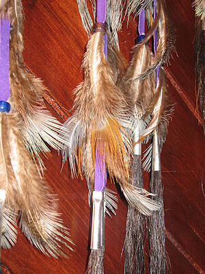 detail of horse hair and pheasant feathers in dreamcatcher