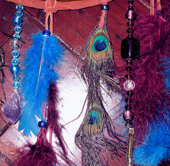 Details of amethyst crystal and peacock feathers dream catcher