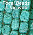 detail of big focal turquoise beads in the dreamcatcher web