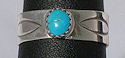 Sterling Silver Turquoise tooled wide band ring.