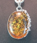 Amber pendant with scrollwork and chain