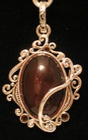 Amber cabachon wwith CZ and scroll work pendant